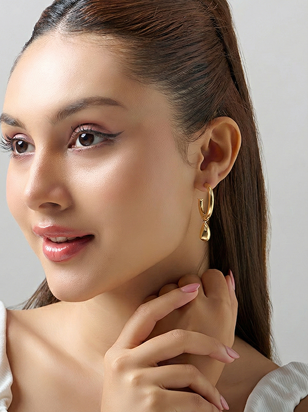 women wearing Gold-plated aquadrop dangle hoop earrings 