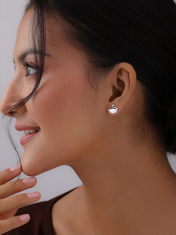 Women wearing Silver Seraphine Swan Stud Earrings