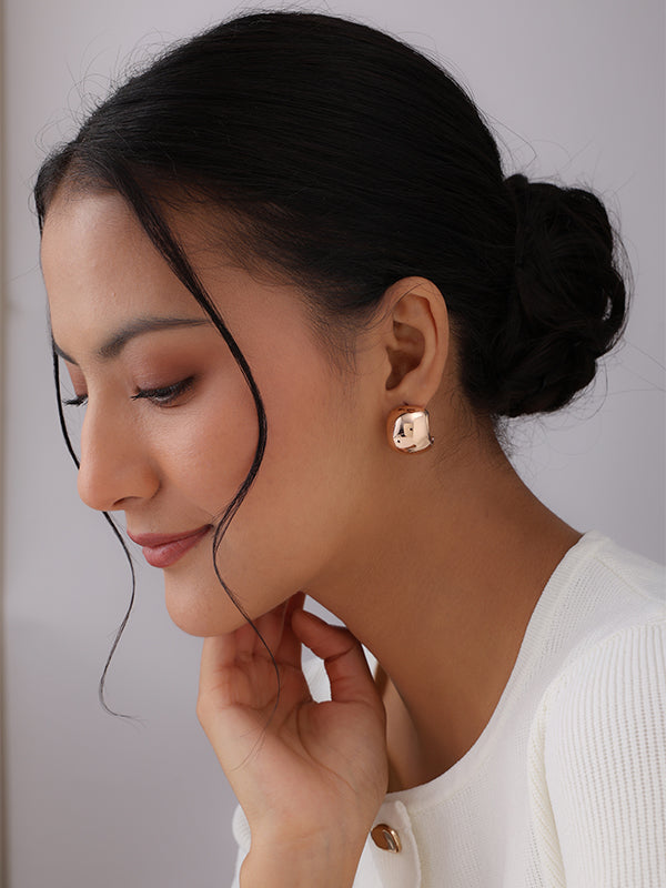 Women?? Eterna dome gold stud earrings close-up