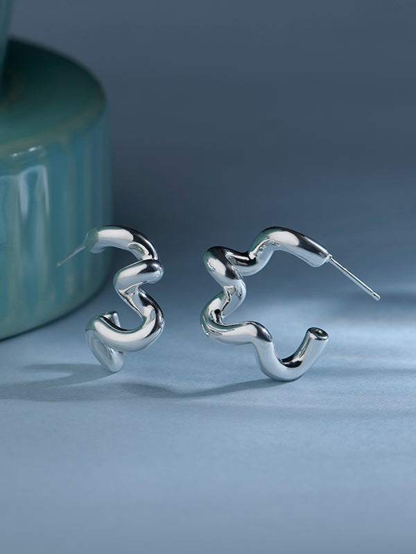 Lumin dual arc sterling silver earrings close-up