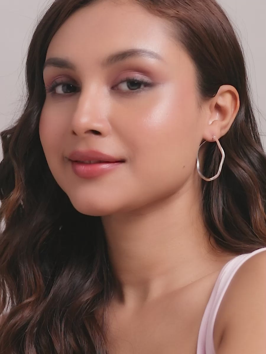 Load video: Silver Wave Twist Hoops