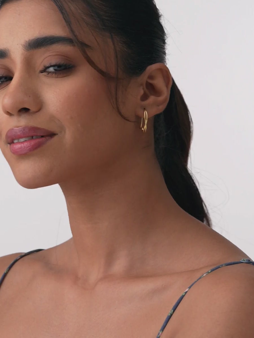 Load video: Gold Twist Pull-Through Hoops