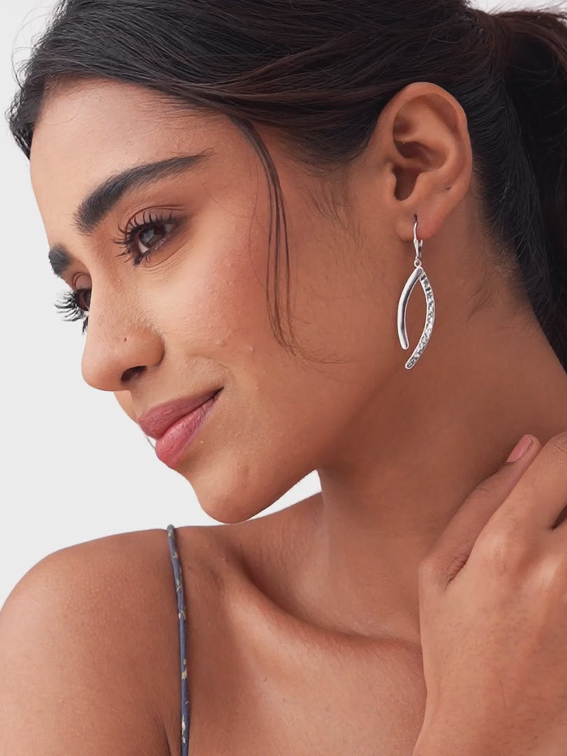 Load video: Celeste Curve Rhodium Dangle Earrings